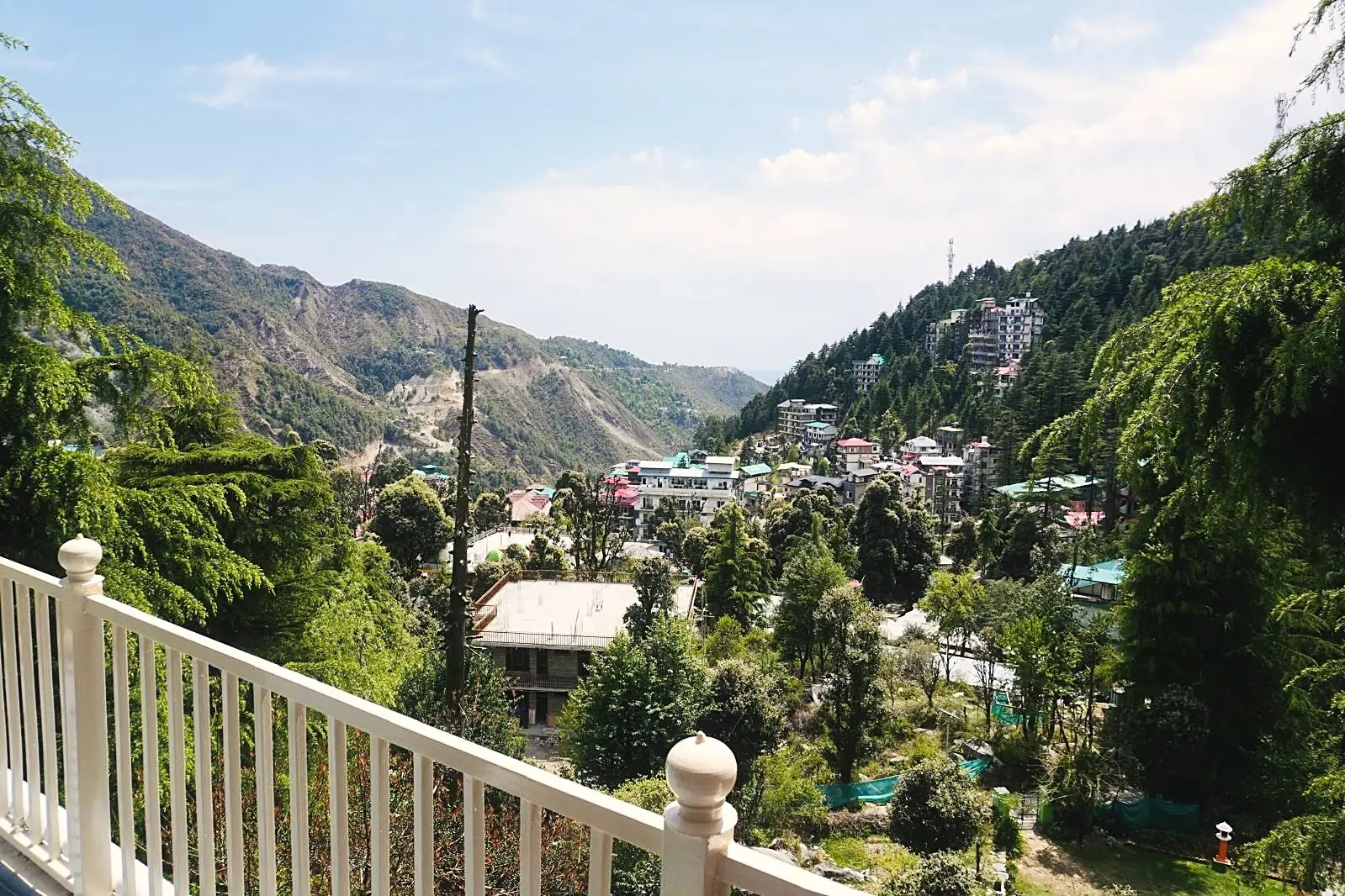 The view from the balcony over town roofs to a dry ridge