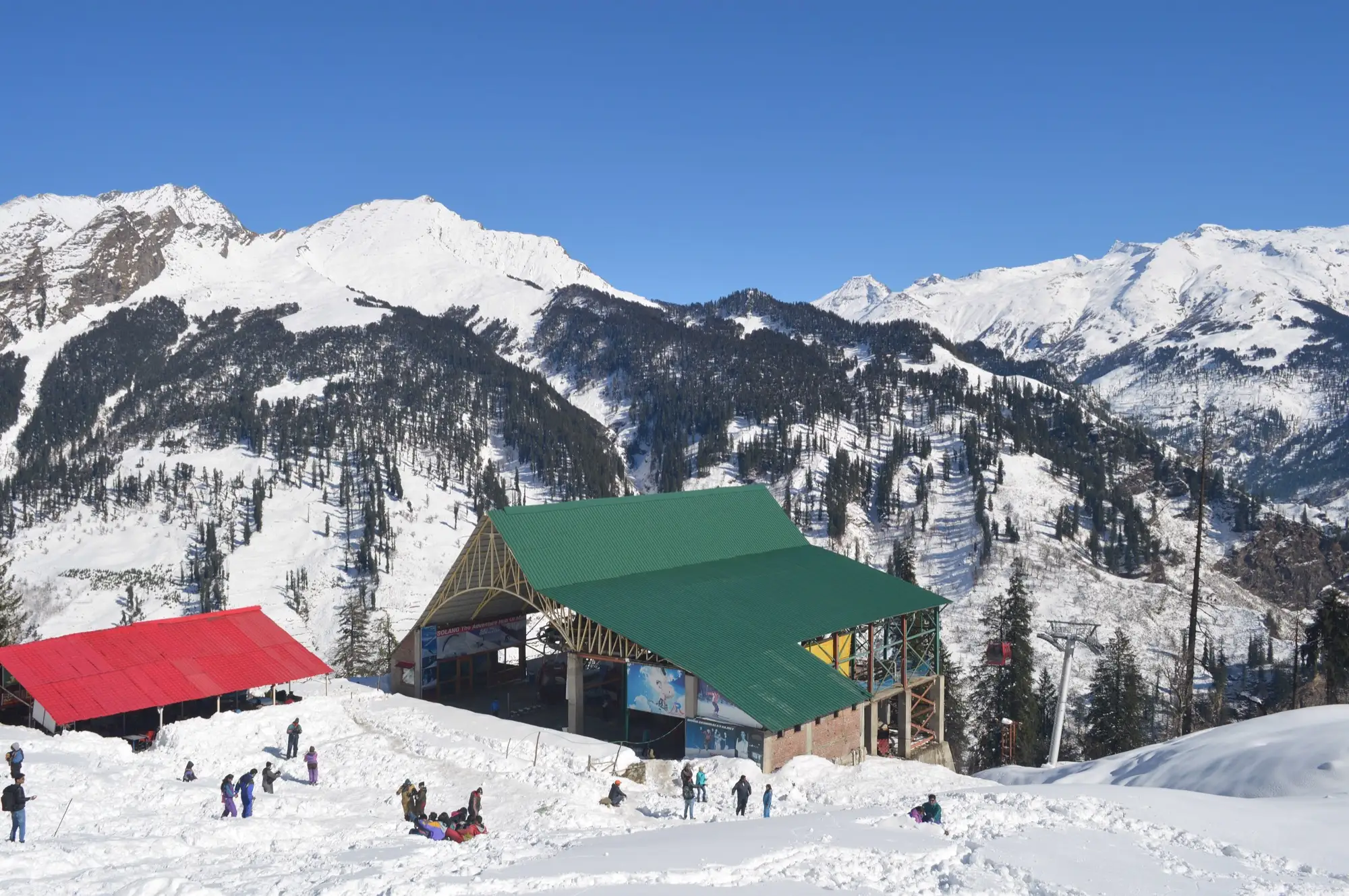 The upper ropeway station at Solang with snow-covered slopes around it