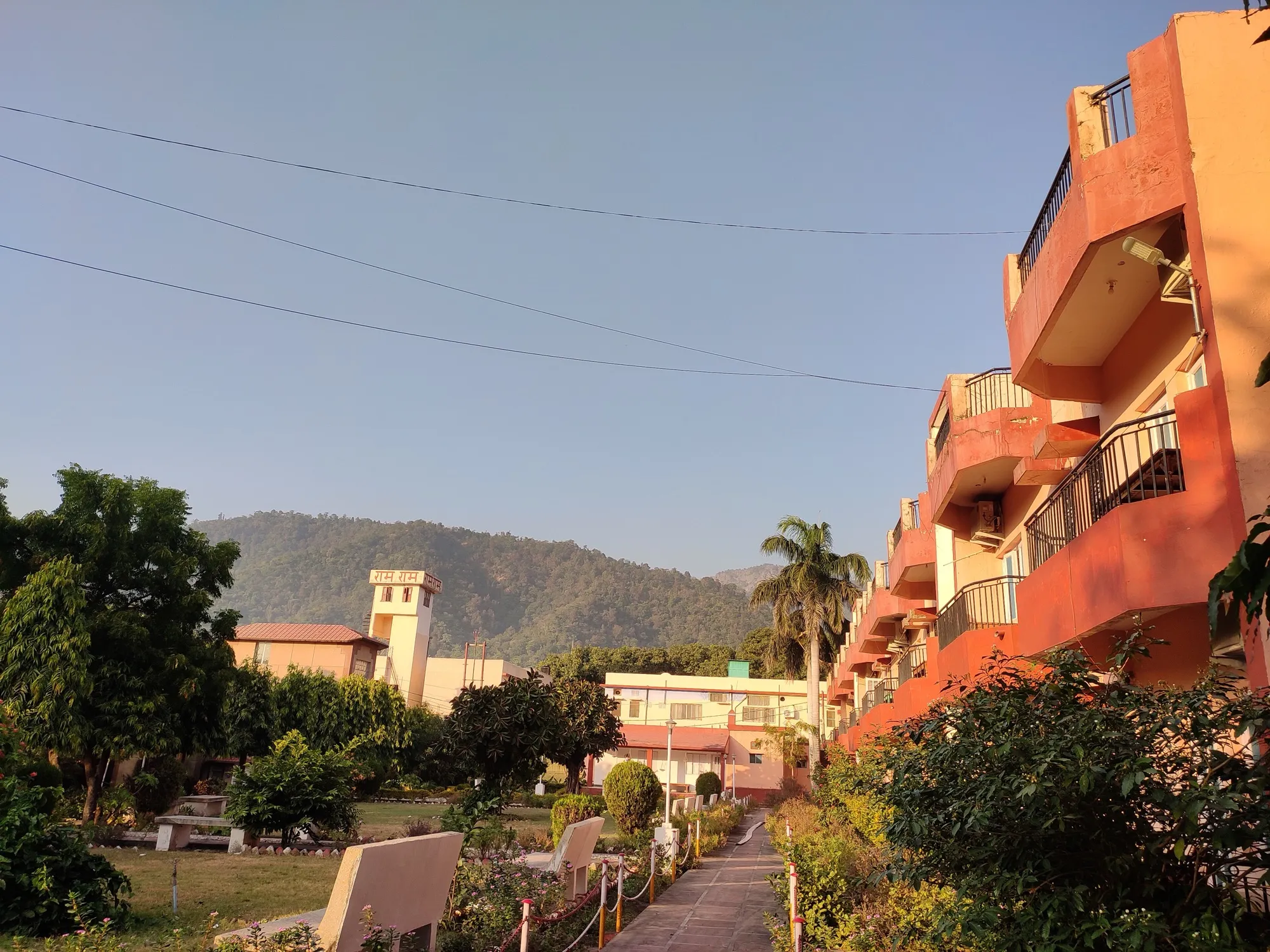 An ashram building with gardens in Swarg Ashram, Rishikesh